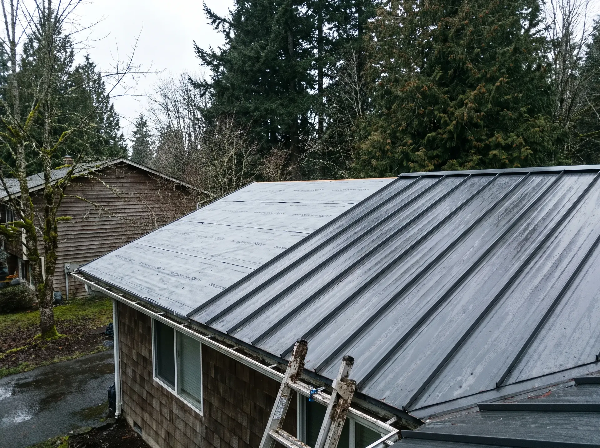 New metal roof partly installed over exposed underlayment